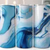 Three Blue And Gold Marble Patterned Tumblers With Straws.
