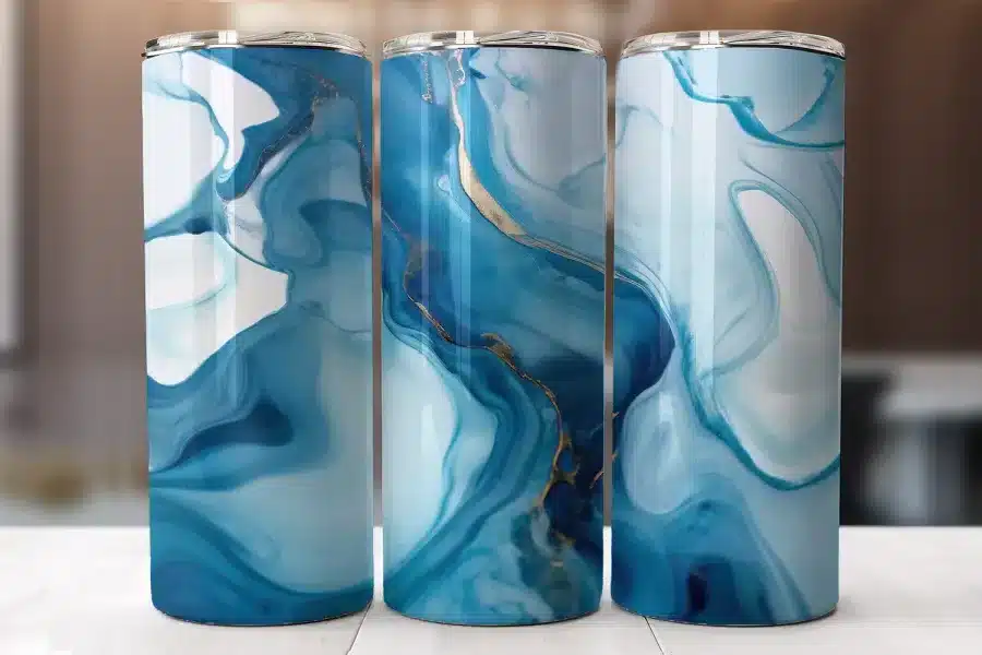 Three Tumblers With A Blue And Gold Marble Design.