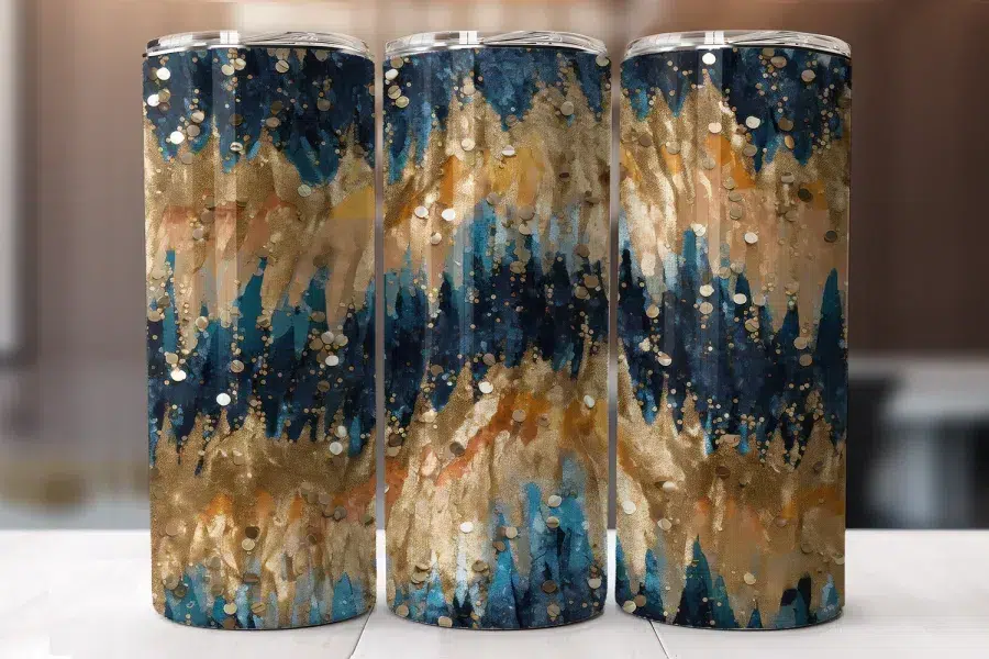 Three Tumblers With An Abstract Design In Shades Of Teal, Gold, And Beige.
