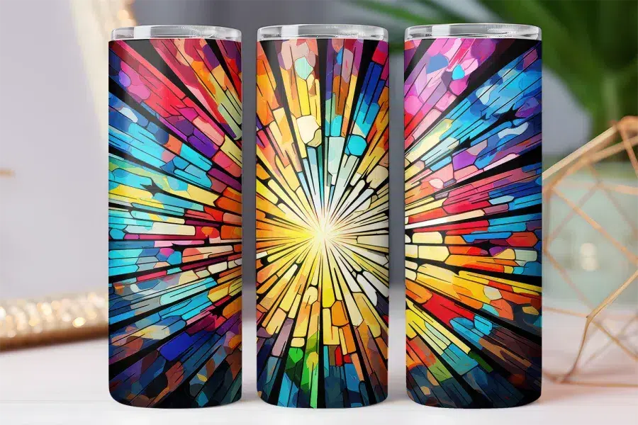 Three colorful tumblers with a stained-glass style radiating design.