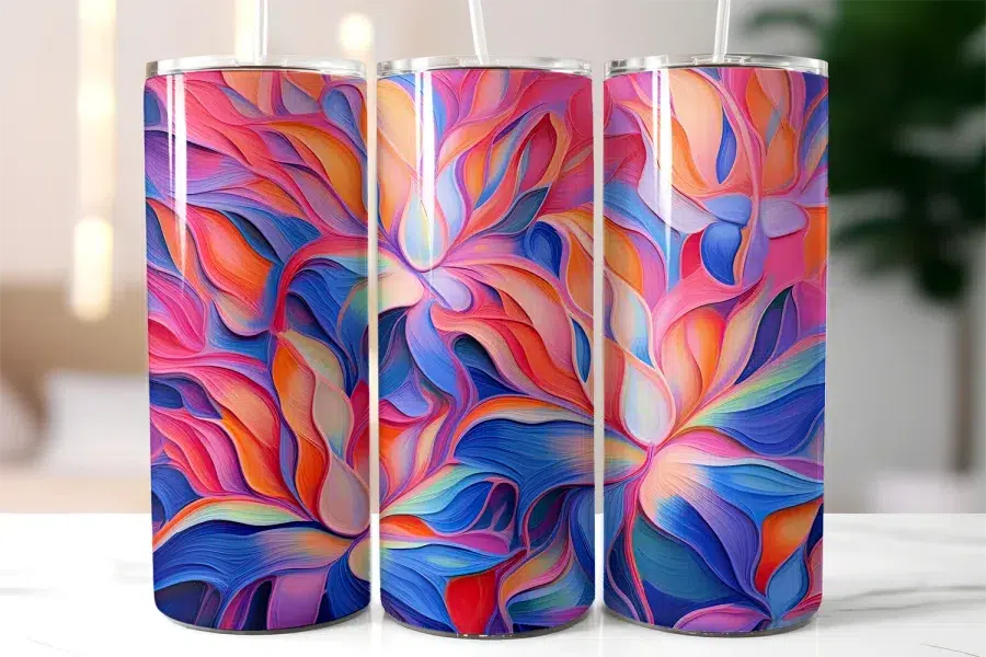 Three Stainless Steel Tumblers With Colorful Abstract Floral Designs.