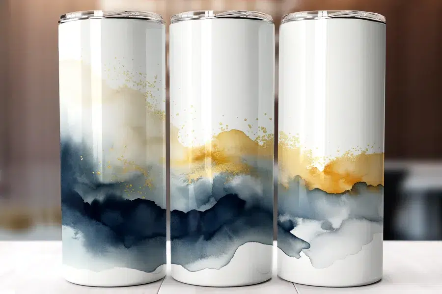 Three White Tumblers With An Abstract Design Featuring Blue, Gray, Gold, And White Watercolor-Style Paint.