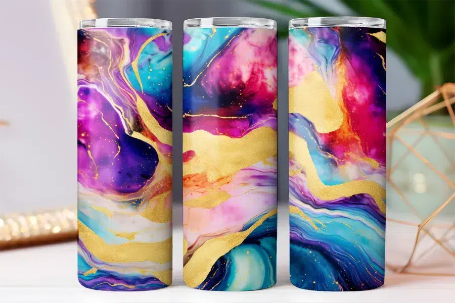 Three tumblers with an abstract design featuring swirling colors of purple, pink, blue, and gold.