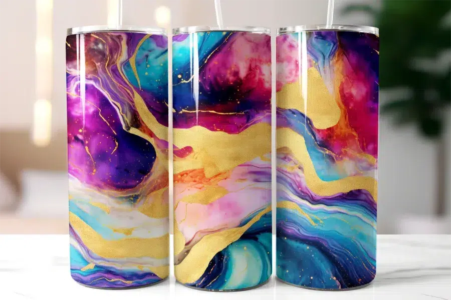 Three Tall Tumblers With Vibrant Abstract Designs Featuring Swirling Purples, Pinks, Blues, And Gold Accents.