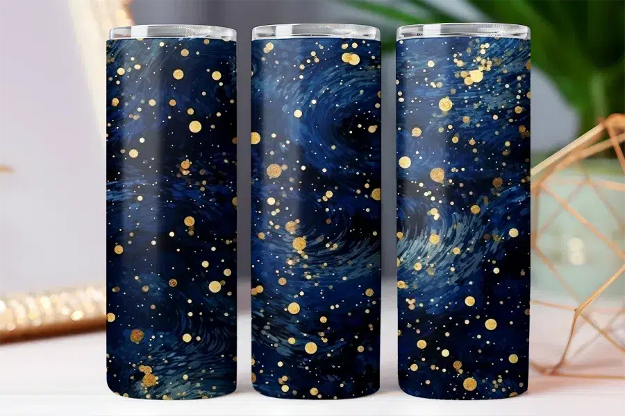 Three dark blue tumblers with a gold speckled design.