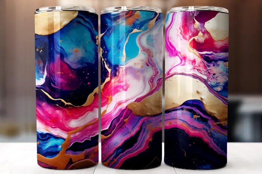 Three Tumblers With Abstract Pink, Blue, Purple, And Gold Marble Designs.