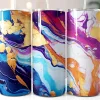 Three Stainless Steel Tumblers With Abstract Marble Designs In Shades Of Purple, Blue, Orange, And Gold.