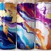 Three Stainless Steel Tumblers With Abstract Marble Designs In Shades Of Blue, Purple, And Orange With Gold Accents.