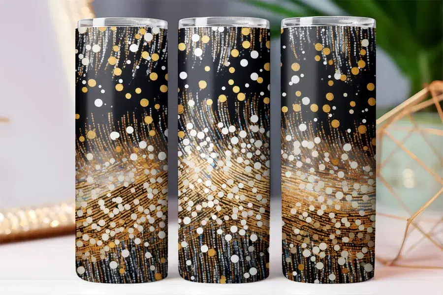 Three black tumblers with a gold and white confetti design.