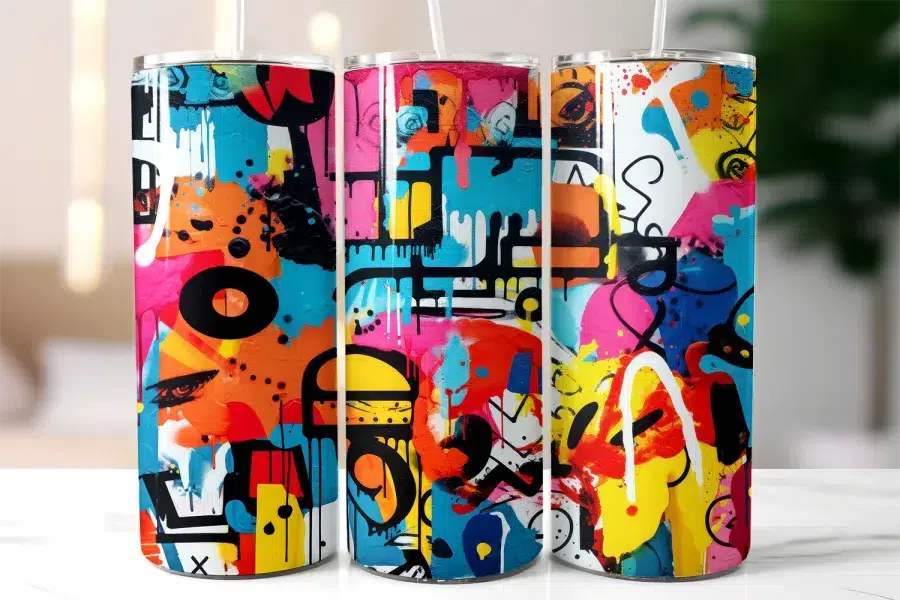 Three Colorful Tumblers With Abstract Graffiti Designs.