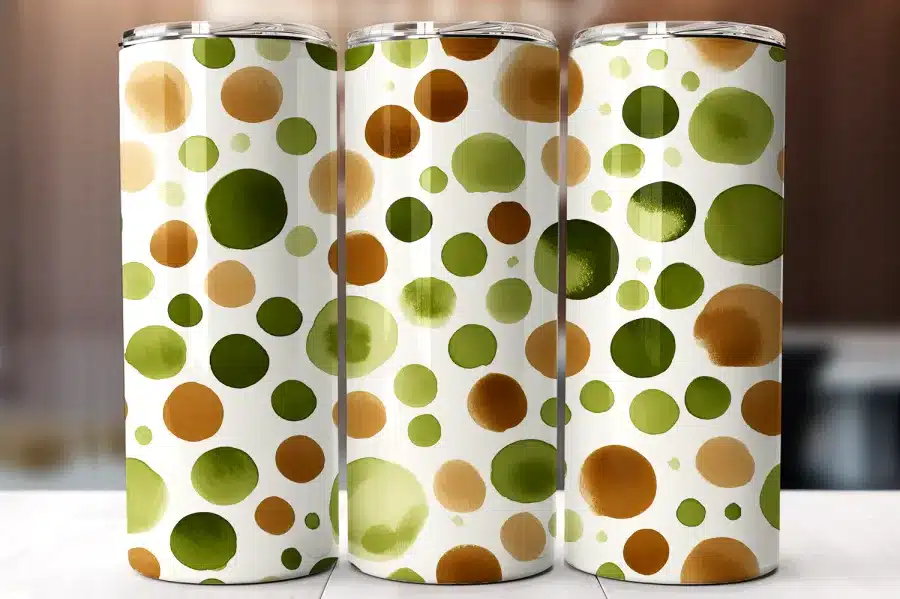Three Tumblers With A Watercolor Dot Pattern In Shades Of Green And Brown.