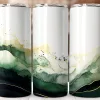 A Group Of Tall Cans With Green And Gold Designs