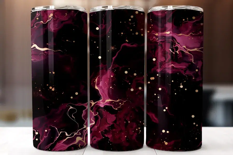 A Group Of Purple And Gold Soda Cans