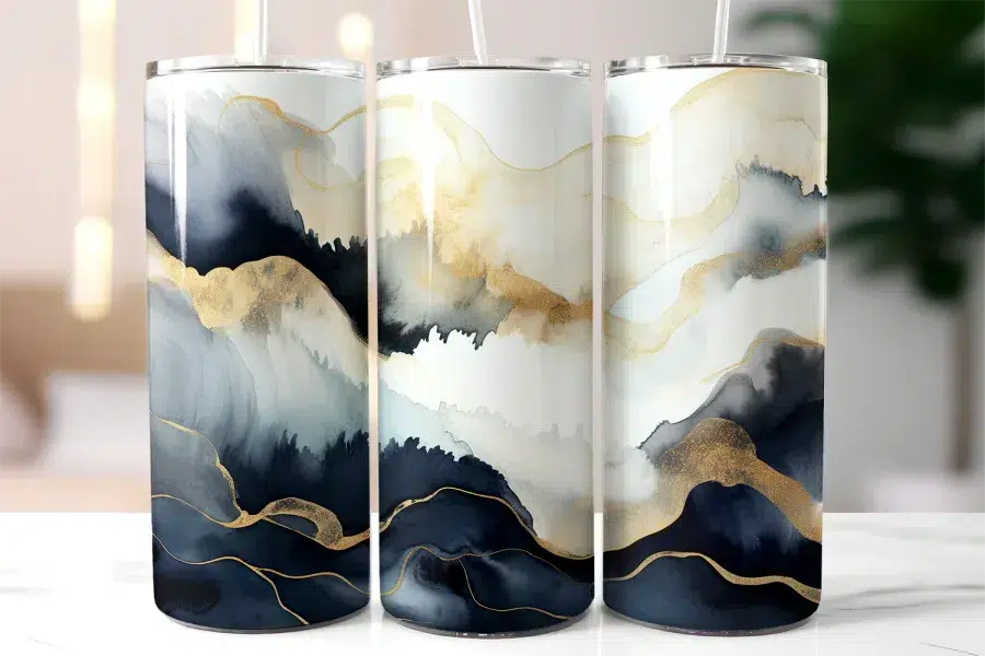 Three Tall Tumblers With An Abstract Design Featuring Navy Blue, Gray, And Gold Watercolor-Style Waves.