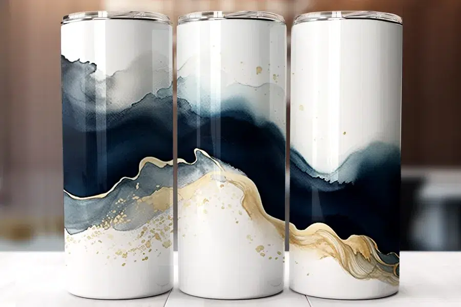 Three White Tumblers With An Abstract Design Featuring Navy Blue And Gold Watercolor Waves.