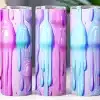 Three Pastel-Colored Tumblers With A Dripping Paint Design.