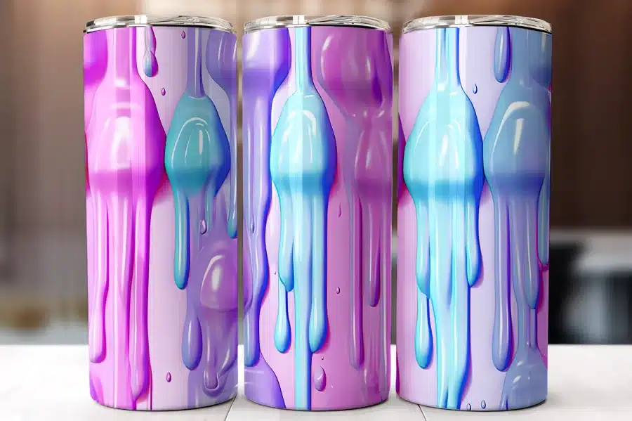Three Pastel-Colored Tumblers With A Dripping Paint Design.