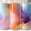 Three Stainless Steel Tumblers With Abstract Feather Designs In Pastel Colors.