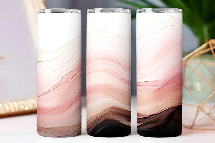 Three tall tumblers with an abstract design of pink, brown, and gold wavy lines.