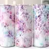 Three Pastel Purple And Blue Patterned Stainless Steel Tumblers With Straws.