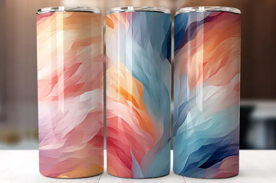 Three Tall Tumblers With Abstract Pastel Designs.