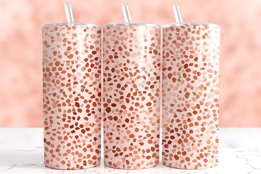 Pink Terrazzo Tumbler Wrap Design Featuring Abstract Pebble Shapes In Coral, Clay, And Blush On A Soft Pink Background