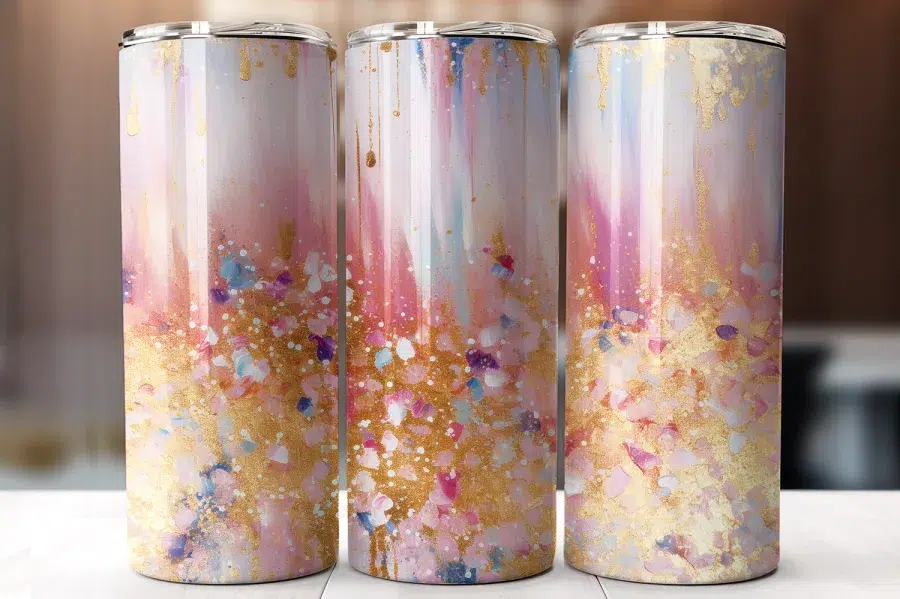 Three Tall Tumblers With An Abstract Design Featuring Pink, Gold, And White Paint Splatter.