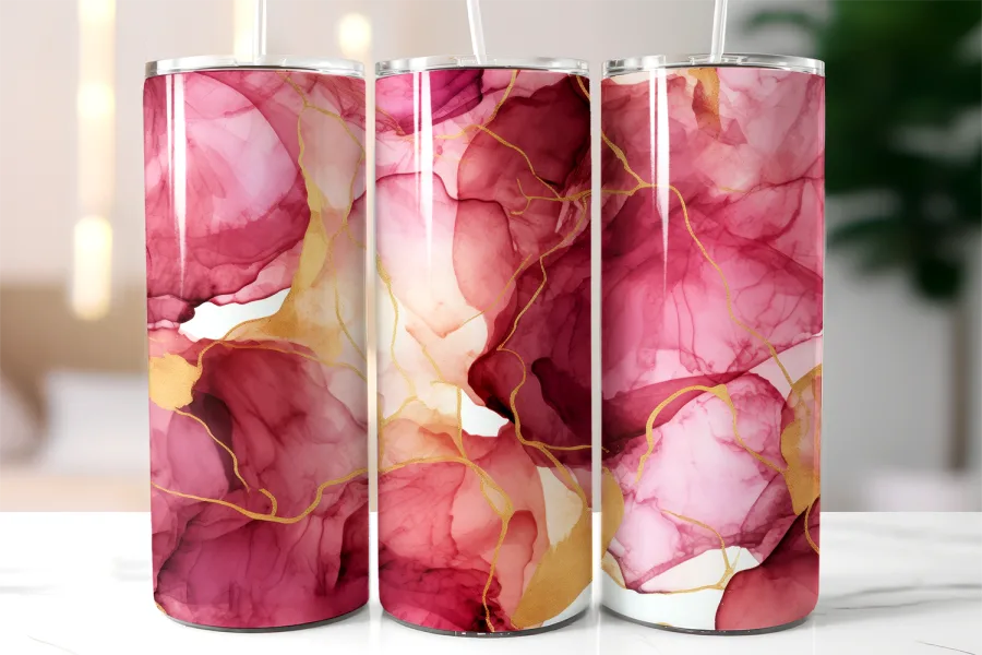 Three Tumblers With A Pink And Gold Abstract Design.