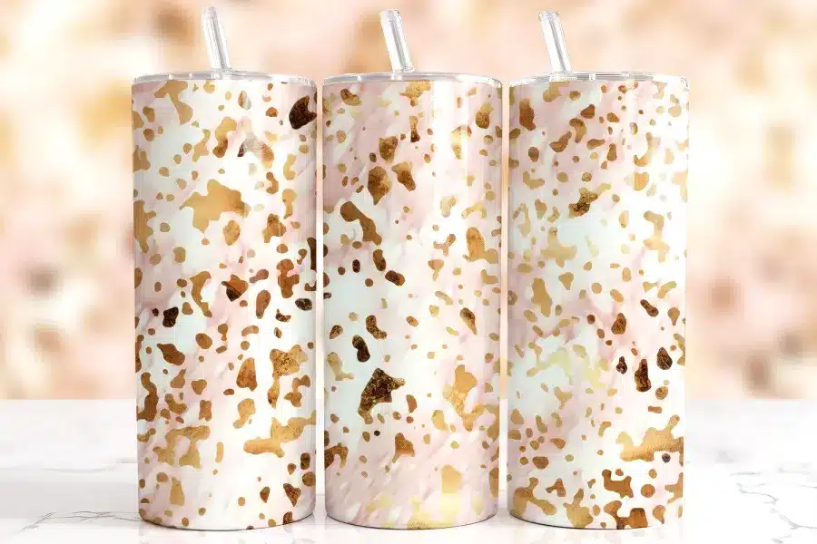Pink Gold Cow Print Tumbler Wrap Design Featuring Metallic Gold Cow Print Spots Scattered Over A Soft Pink Background With Subtle Glossy Texture