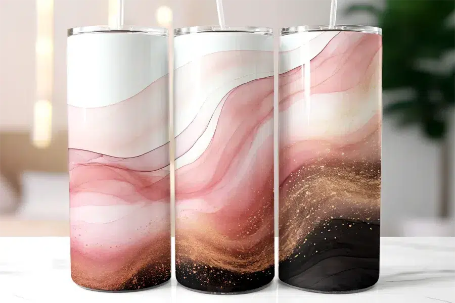 Three Tall Tumblers With Pink, Gold, And Black Abstract Designs.