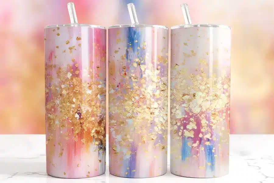 Pink Blue Gold Tumbler Wrap Design Featuring Pastel Watercolor Background In Pink, Sky Blue, And Peach With Scattered Metallic Gold Flakes And Glitter Accents