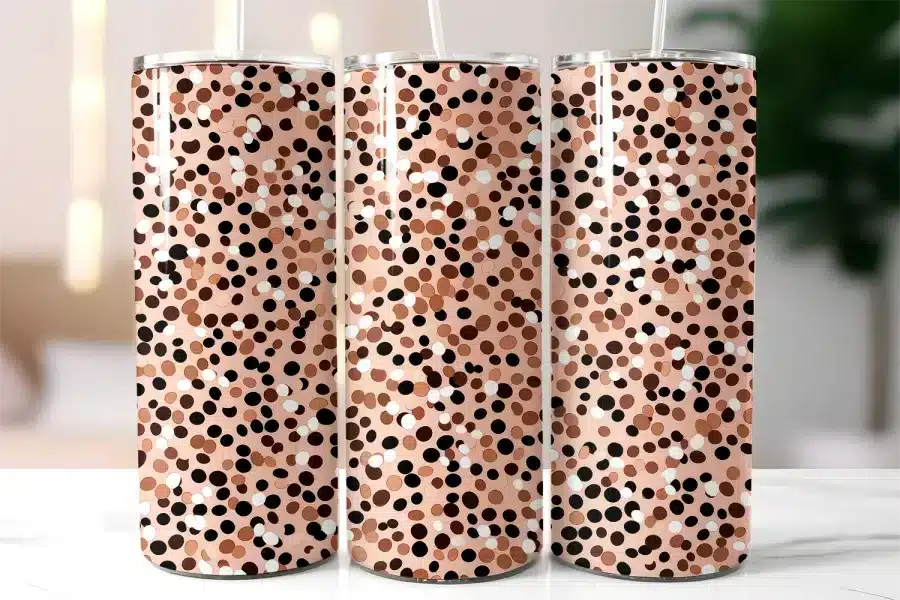 Three Tall Tumblers With A Pink And Brown Polka Dot Pattern.