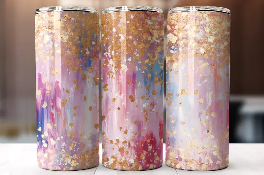 Three Pastel Pink And Gold Tumblers With An Abstract Paint Splatter Design.