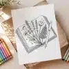 Line Drawing Of Flowers Pressed In An Open Book With A Pen Resting On Top.