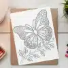 A Coloring Page Featuring An Ornate Butterfly Perched On A Leafy Branch.