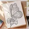 Line Drawing Of A Butterfly On A Flower.