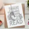 Line Drawing Of A Hanging Chair In Front Of A Bookshelf, With The Word Read Incorporated Into The Design.
