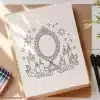A Coloring Page Depicting An Ornate Mirror Surrounded By Candles And Crystals.