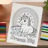 A Coloring Page Featuring A Cute Unicorn Sitting Under A Rainbow, Surrounded By Flowers And Stars.  The Words Dream Big Are Printed Below.