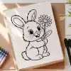 Line Drawing Of A Cute Bunny Holding A Flower.