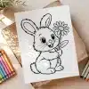 A Coloring Page Featuring A Cute Cartoon Bunny Holding A Flower.