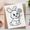 Line Drawing Of A Happy Bunny Holding A Flower.