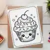 A Coloring Page Featuring A Cute Cupcake With A Cherry On Top And Smiling Face.