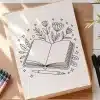 Line Drawing Of An Open Book With Flowers And Leaves Emerging From It, And A Pen Resting Below.