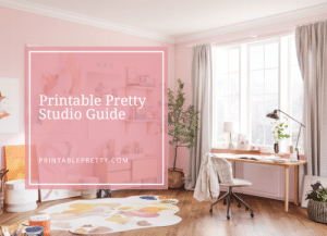 Soft pink home office scene with modern decor, large window, and white desk, overlaid with text that reads Printable Pretty Studio Guide — patternprofitstudio.com