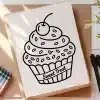A Drawing Of A Cupcake On A Piece Of Paper
