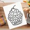 A Drawing Of A Cupcake And Crayons On A Wooden Surface