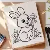 A Drawing Of A Rabbit Holding A Flower
