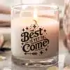 A Lit Candle In A Clear Glass Jar With The Text The Best Is Yet To Come.
