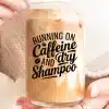 Hands Holding A Glass Iced Coffee With The Text Running On Caffeine And Dry Shampoo.